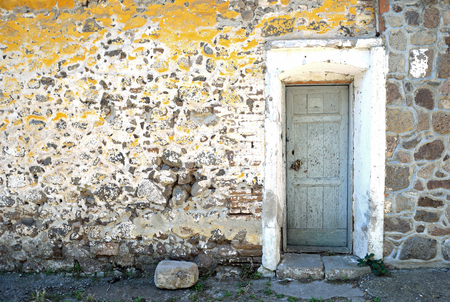 Old Door Molyvos and rustic stone wallの写真素材