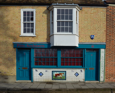 Built in 1904/5 colourful Decorated tiles front. the old butchers shop.のeditorial素材