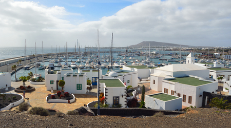 The  marina area of  Playa Blanca Lanzarote Spain with yachts and shops.のeditorial素材