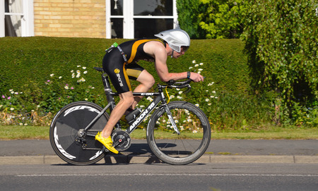Triathlete on bicycle St Neots Cambridgeshire England.のeditorial素材