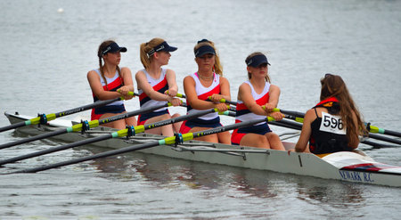 Close up of Female Scullers, Newark Coxed four on the River Ouse at St Neots.