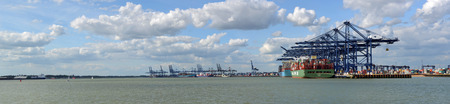 Container ships being loaded and unloaded at Felixstowe docks suffolk Panorama  England.のeditorial素材