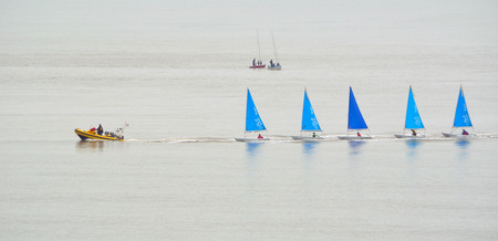 FELIXSTOWE, SUFFOLK, ENGLAND - JUNE 11, 2016: Colourful Sailing Dinghies together at the estuary of the river Deben at Felixstowe Ferry Suffolk England.のeditorial素材