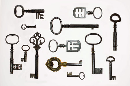 A Collection of 13 interesting  Antique Keys on white backgroundの写真素材