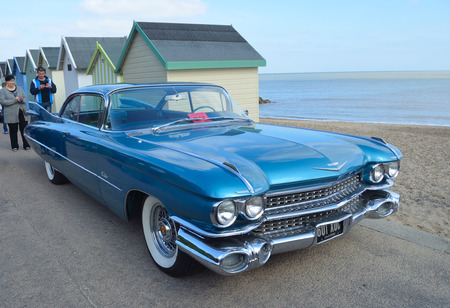 FELIXSTOWE, SUFFOLK, ENGLAND -  MAY 07, 2017:  Classic Blue Cadillac Automobile parked on seafront promenade.のeditorial素材