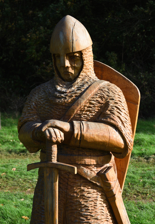 BATTLE, EAST SUSSEX, ENGLAND - OCTOBER 20, 2017: Carved wooden statue of  Battle of Hastings Soldier,のeditorial素材