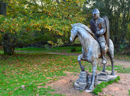 BATTLE, EAST SUSSEX, ENGLAND - OCTOBER 20, 2017: Carved wooden statue of  Battle of Hastings Soldier on horse back,のeditorial素材