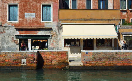 VENICE, ITALY - SEPTEMBER 26, 2018: Canal side shops in the Dorsodura region of Venice.のeditorial素材