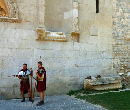 SPLIT, CROATIA - JUNE 21 , 2018: Men dressed as Roman Soldiers  by historic Palace Wall.のeditorial素材