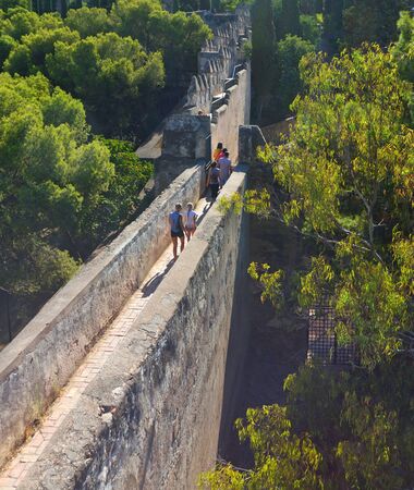 MALAGA, ANDALUCIA, SPAIN - SEPTEMBER 25, 2018: View of Malaga f Castle Wall with Tourists.のeditorial素材