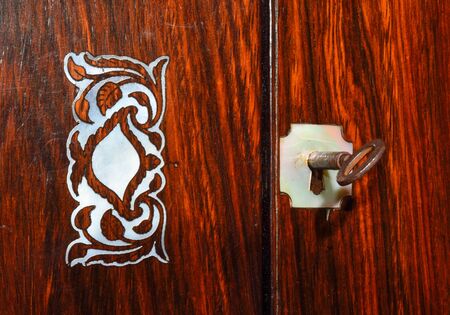 Box Top in Rosewood with Mother of Pearl inlay and escutcheon and Keyの写真素材