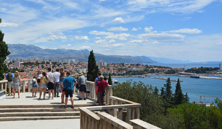 SPLIT, CROATIA - JUNE 25, 2018: Tourist at viewpoint overlooking Split seafront and ocean.のeditorial素材