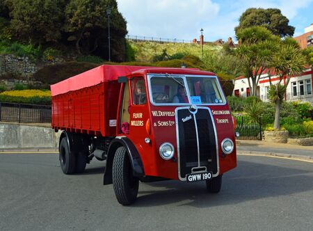 FELIXSTOWE, SUFFOLK, ENGLAND - MAY 05, 2019: Vintage red Sentinel  Truck being driven on road.のeditorial素材