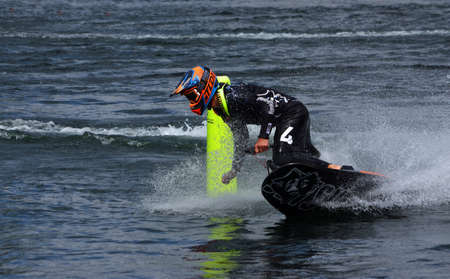 WYBOSTON, BEDFORDSHIRE, ENGLAND - JULY 07, 2019: Male Motorsurf Competitor cornering at speed.のeditorial素材