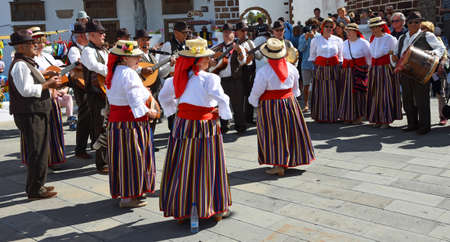 TEGUISE, LANZAROTE, SPAIN - MARCH 31, 2019: Dancers and musicians performing in traditional dress in market place.のeditorial素材
