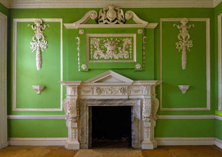 SILSOE, BEDFORDSHIRE, ENGLAND -  SEPTEMBER 04, 2020: Ornate marble chimneypiece and decorative plaster panels, dado and cornicesのeditorial素材