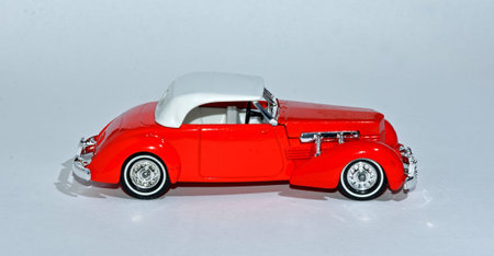 ST NEOTS, CAMBRIDGESHIRE, ENGLAND - OCTOBER 20, 2020:  Toy 1937  Vintage Red  Cord 812  Car  with...