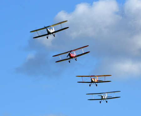 Four Vintage  SNCAN Stampe - Vertongen SV-4 Biplanes in flying formation.のeditorial素材