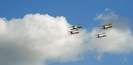 Vintage Tiger Moth Bi Planes Flying in formation blue sky and clouds.のeditorial素材