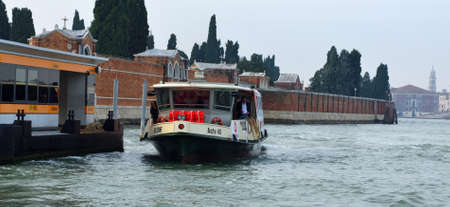 Cimitero  vaporetto stop water bus  approaching the cemetery islandのeditorial素材