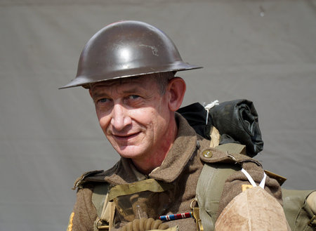 Man in WW1 Uniform head and shoulders with helmet.
