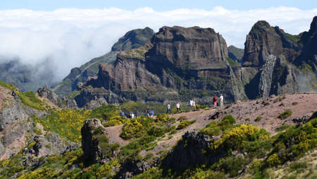 Tourists at the top of Pico do Arieiro one of the highest peaks in Maderiaのeditorial素材
