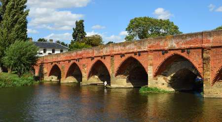 Great Barford Packhorse Bridge and pub Bedfordshire England.の写真素材