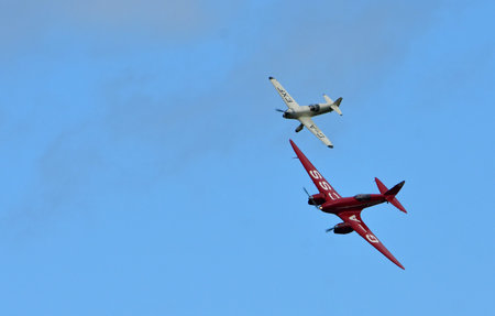 Vintage DH88 Comet De Havilland  and 1936 Percival Mew Gull  Aircraft  in flight.