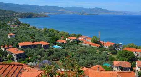 Molyvos, Lesvos, Greece Hotels, Restaurants and Beach with mountains in the background.のeditorial素材