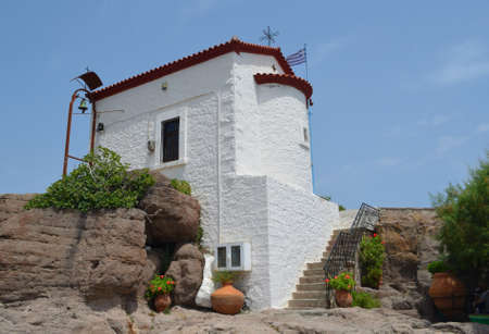 The Tiny Mermaid Madonna Church sits right by the harbour at Skala Sikaminias  Lesvos Greeceのeditorial素材