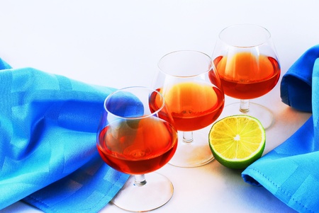 Three glasses of brandy on white background の写真素材