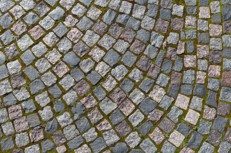 Pavement of granite stone.Old cobblestone road pavement texture,