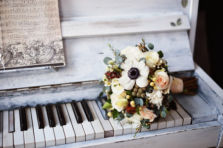 Bridal bouquet on the pianoの写真素材