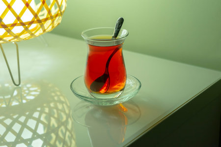 Traditional Turkish tea on shelf with reflection.の写真素材