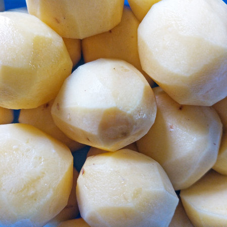 Yellow potatoes ready to cook.の写真素材