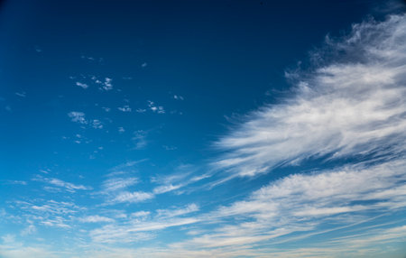 frayed cirrus clouds on deep blue skyの写真素材