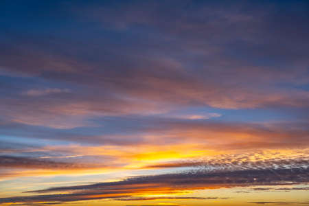 dusk with awesome sunset sky from golden hour to blue hour with copy spaceの写真素材