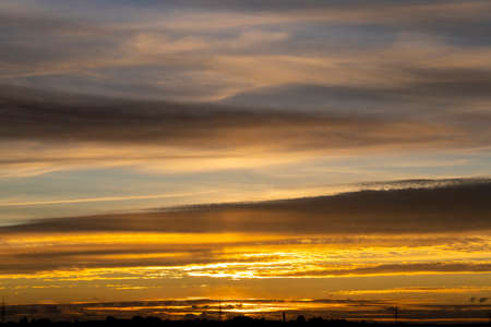 dusk with awesome sunset sky from golden hour to blue hour with copy spaceの写真素材