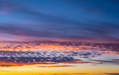 dusk with awesome sunset sky from golden hour to blue hour with copy spaceの写真素材