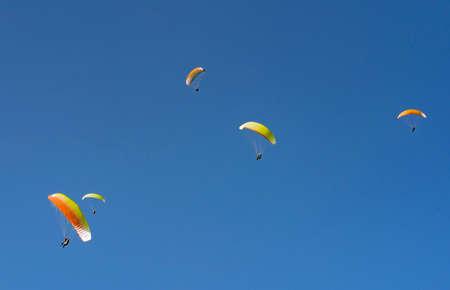 Immenstadt, Bavaria, Germany - 06-02-2020, Paragliders competition in the blue sky of the Allgau alps at Mittag summit in Immenstadtのeditorial素材