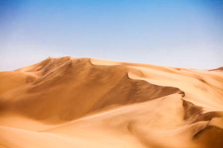 Sand dunes in The Namib desert along side the atlantic ocean coast, southern Africa, Namibiaの写真素材