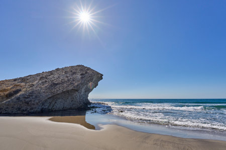 Beautiful beach with rocks and blue sky, Algarve, Portugalの写真素材