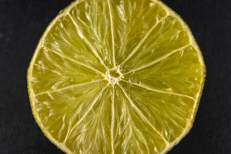 A lemon cut in half photographed with macro photographyの写真素材