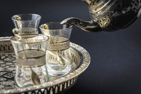 Detail of a metal cup and Turkish glasses, a nice tableware of Arab origin