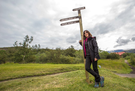 A young woman at the 54 km  signal of the 4-day trek to Landmannalaugar. Iceland