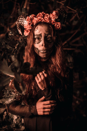 Halloween, Mexican skull with flowers on the head, a young woman in disguise