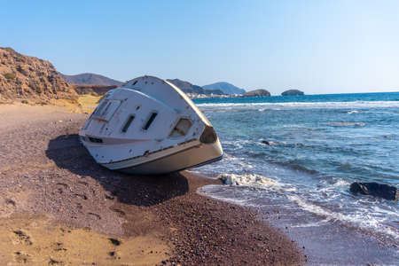 An abandoned boat on Playa los Escullos in the Cabo de Gata natural park, Nijar, Andalucia. Spain, Mediterranean Seaの写真素材