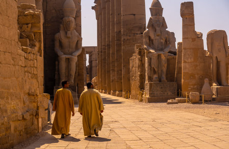 Luxor, Egypt ', October 11, 2020: Two local men visiting the Egyptian Temple of Luxor