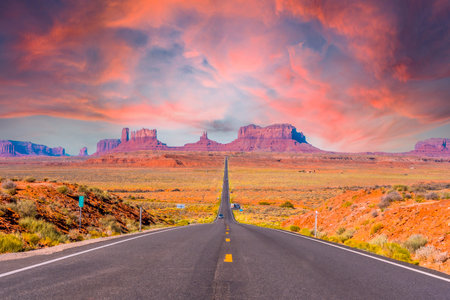 Highway reaching Monument Valley at sunset, Utah. United Statesの写真素材
