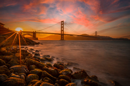 Gorgeous orange sunset with pink clouds over the Golden Gate in San Francisco, California. United Statesの写真素材